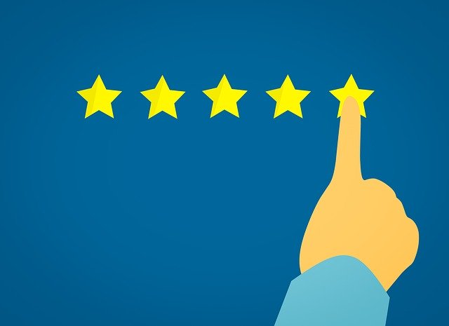 A finger selecting a five-star quality rating, indicating better value achieved when utilising a business analyst.