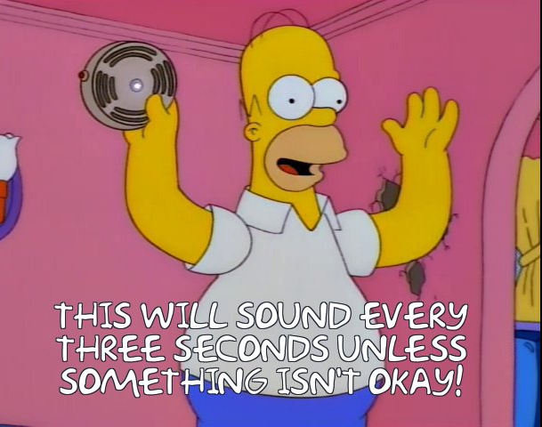 Homer Simpson holding his "everything's ok alarm" illustrating the need for better reporting requirements.