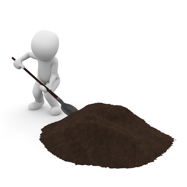 A person digging soil.