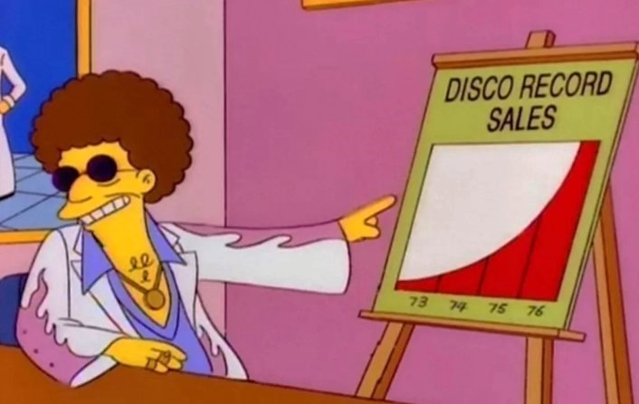 The Simpsons character Disco Stu points at a chart showing the exponential rise of Disco record sales during the 1970s.